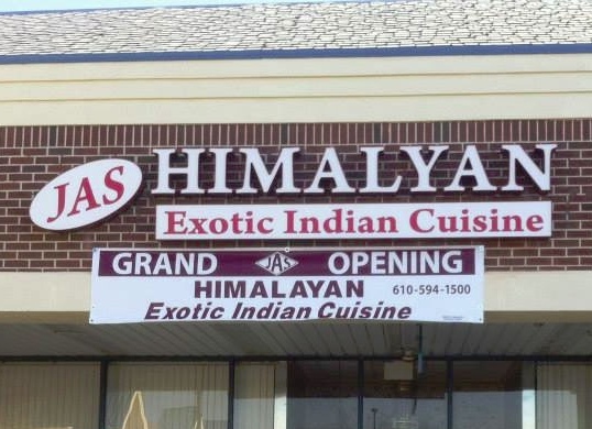 A storefront sign featuring channel letters and sign cabinets.