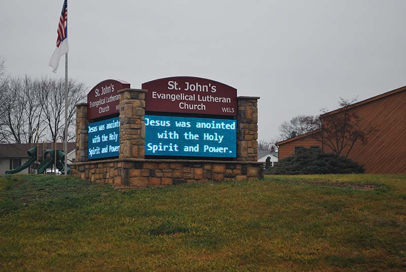 A church sign with a digital message board, created by KC Sign & Awnings.